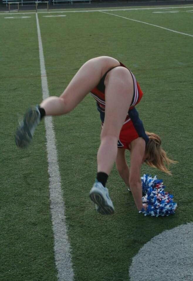 Hot cheerleader doing a handstand picture