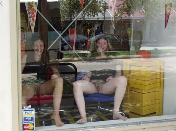 Two college girls spreading in the window picture