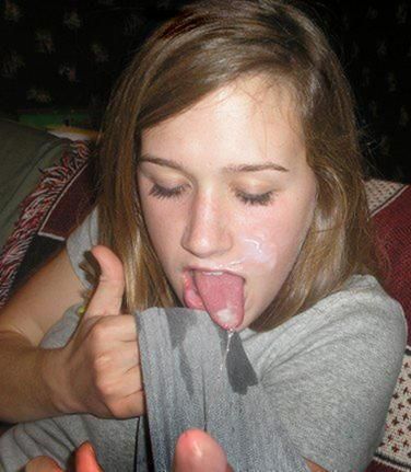 Cute Teen Licks the cum off her shirt picture