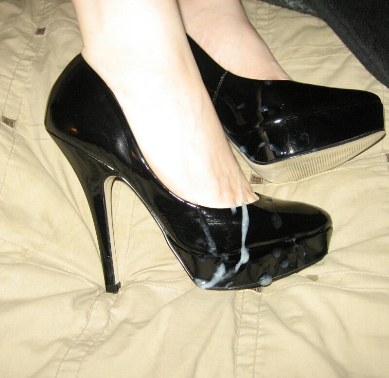 Cumshot on black high heels picture