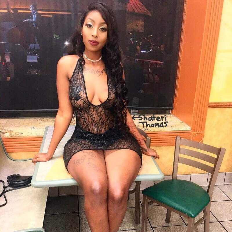 Ebony slut prost. sitting nasty loose infected pussy ass on public table. very saggy big tits picture