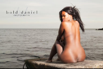 Noemie nude on a rock. picture