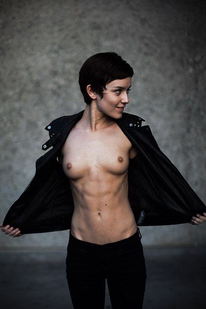 Short-haired brunette tomboy flashing her tits. picture