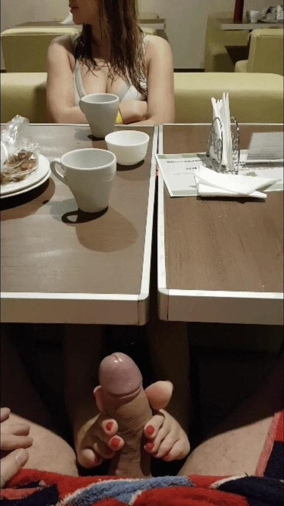 Footjob in restaurant picture