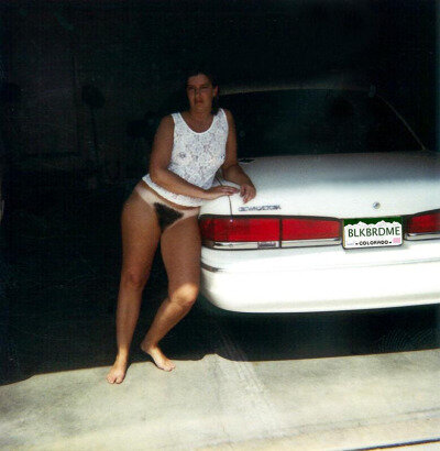 My wife proudly displaying her BLACK BREED ME license plate picture