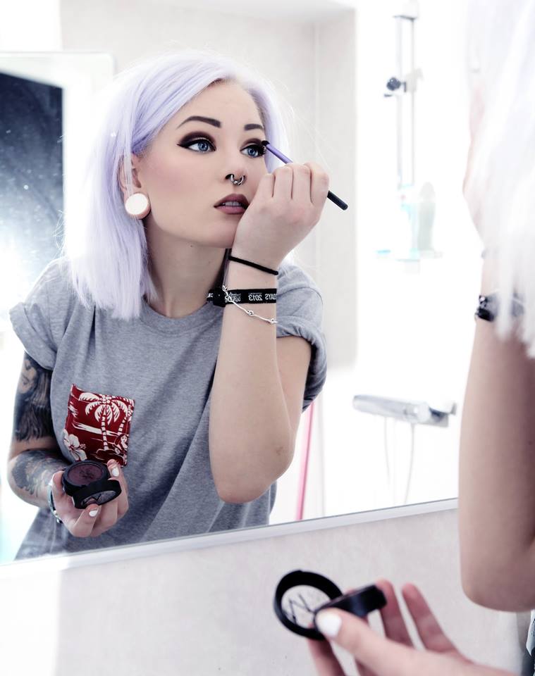 hot! lavender haired glam-punk putting on her makeup picture