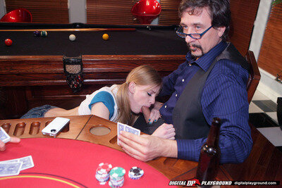 This slut is sucking cock at the poker table picture