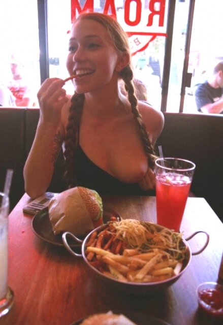 Redhead flashing in restaurant picture