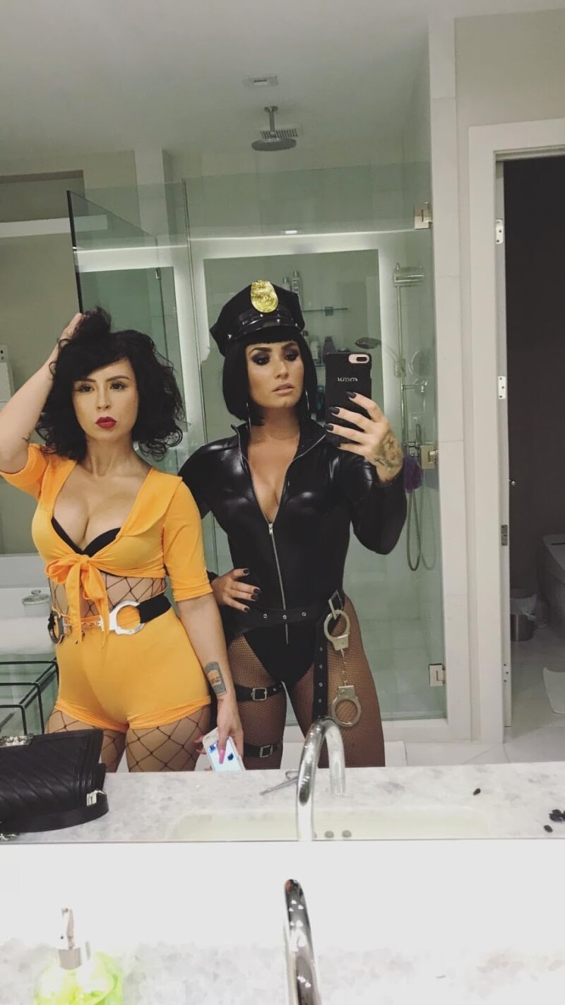 Singer/Actress Demi Lovato dressed as a Hot cop with some friend on Halloween 2017 mirror selfie picture