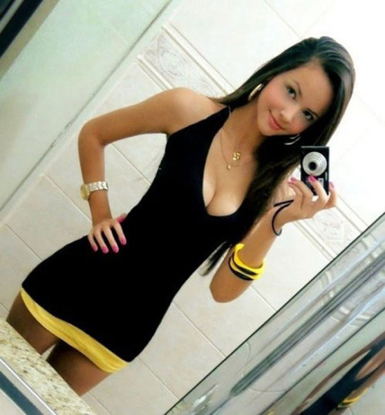 Cute teen in tight black dress. picture