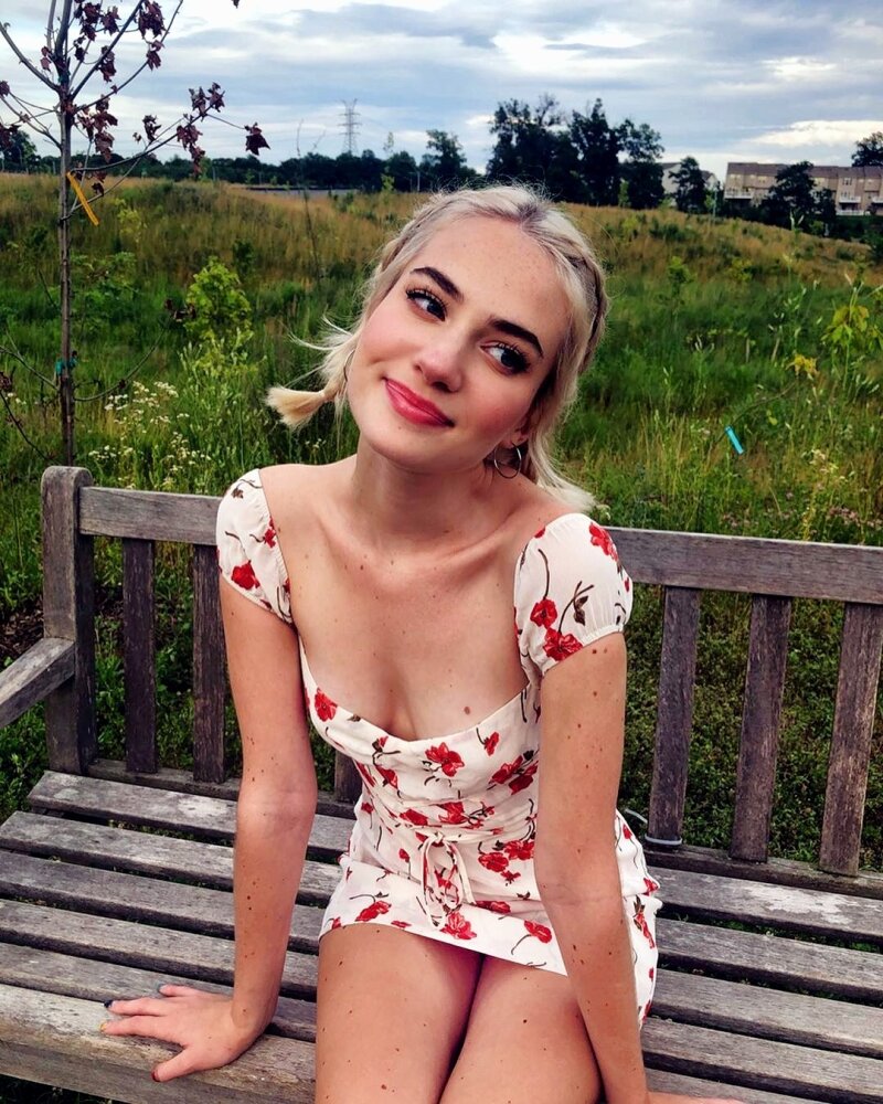 Cute blond Babe on park bench in a minidress picture