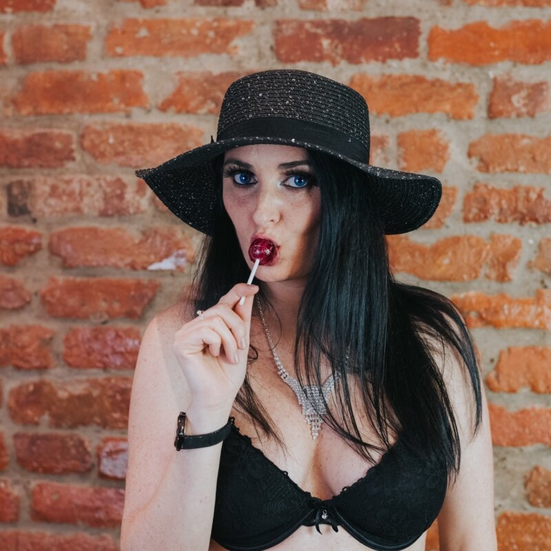 sexy brunet with blue eyes sucking lollipop picture