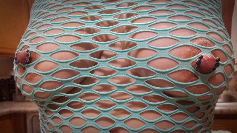Hard pierced pokey nipples through mesh top picture