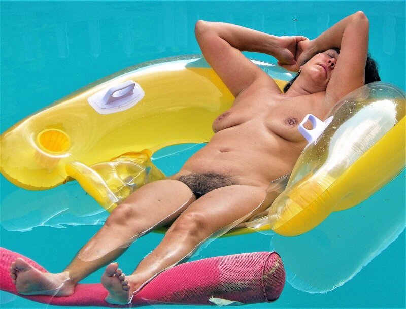 Mature Wife Sunbathing nude exposing her hairy cunt picture