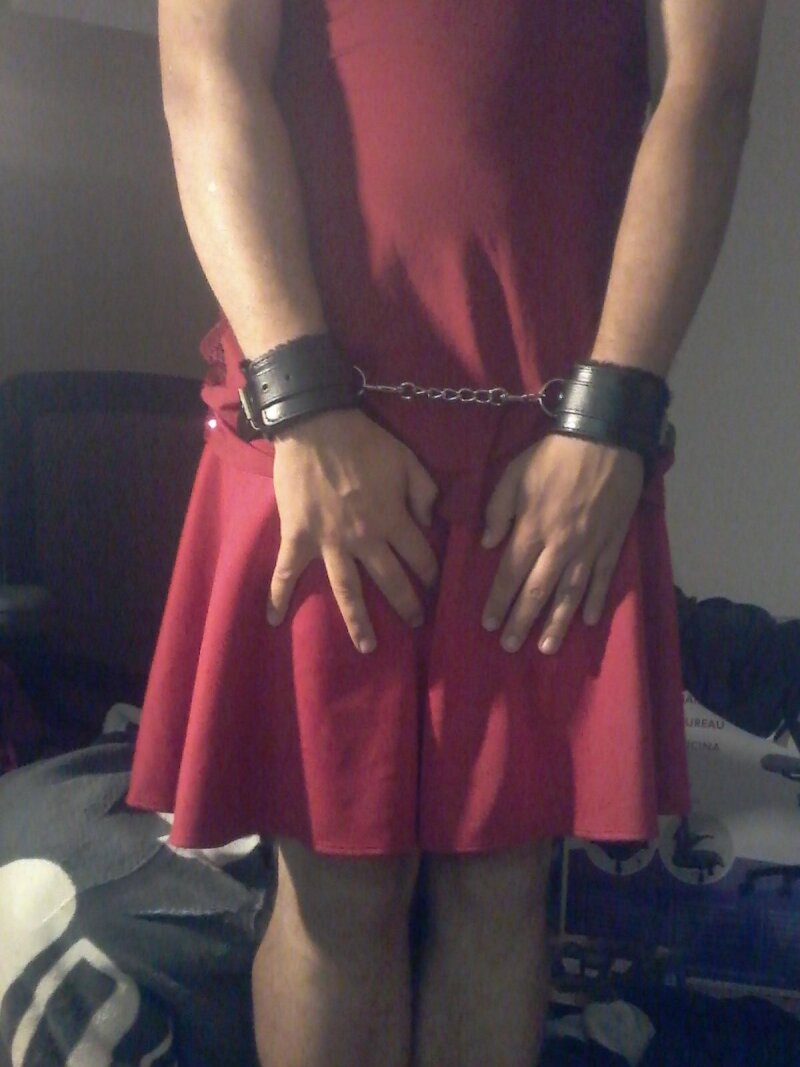 Posing in my sexy skirt and handcuffs picture