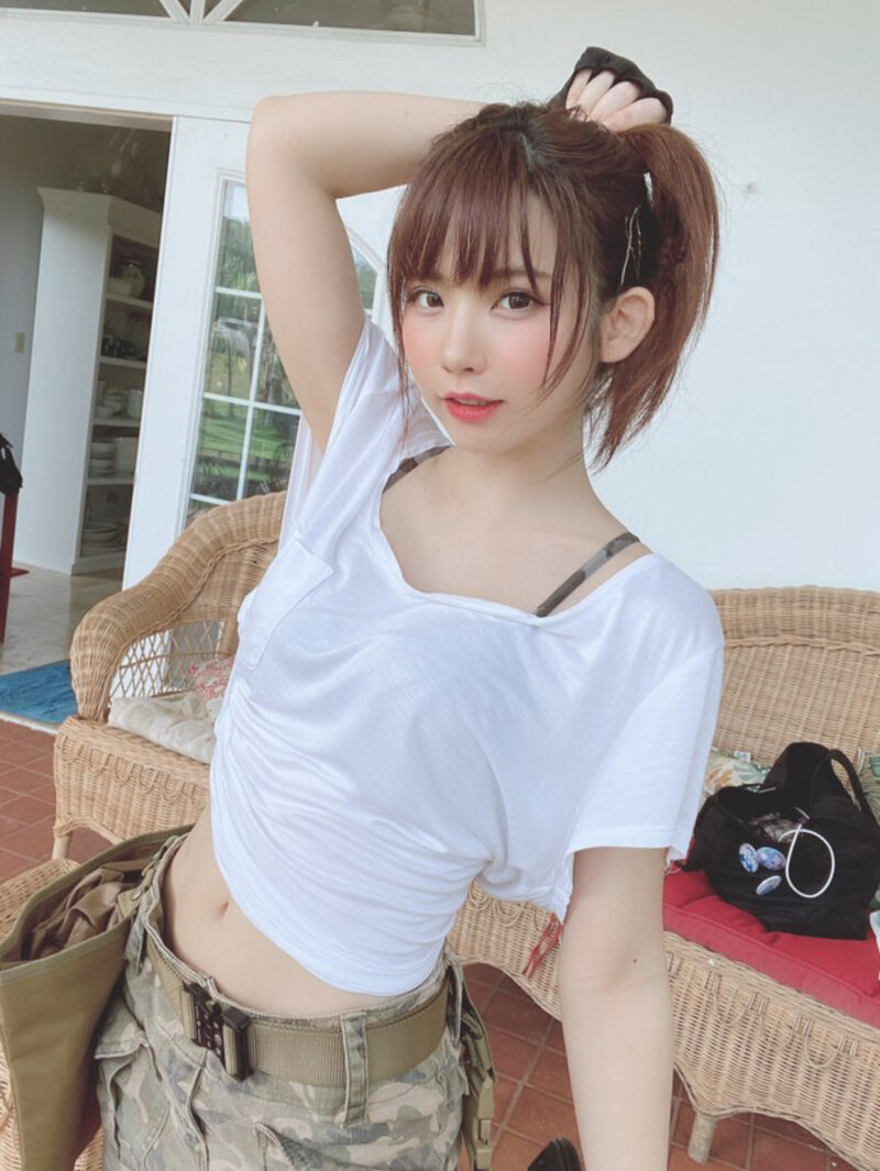 Beautiful Asian teen Enako pulling her hair back picture