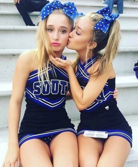 two cheerleaders having a break picture