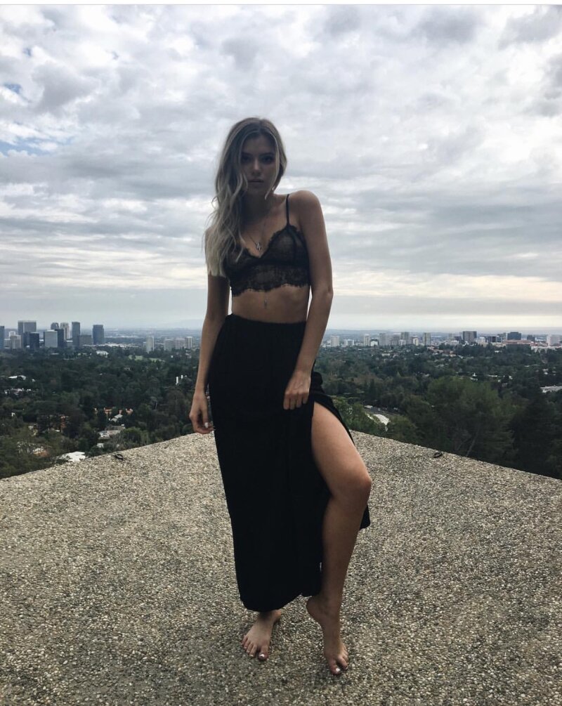 Alissa Violet is looking sexy as hell in black laced top in a black dress picture