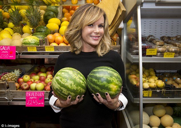 The actress gets her hands on a pair of large melons during the book signing trip to her village grocery picture