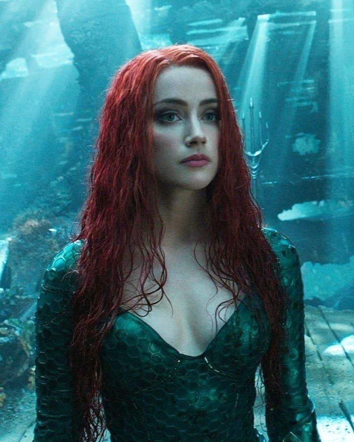 Amber Heard is looking sexy as hell with big boobs and cleavage picture