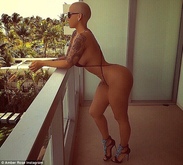 Nearly naked: Amber Rose shared Instagram photos on Saturday while clad in a barely-there black monokini picture