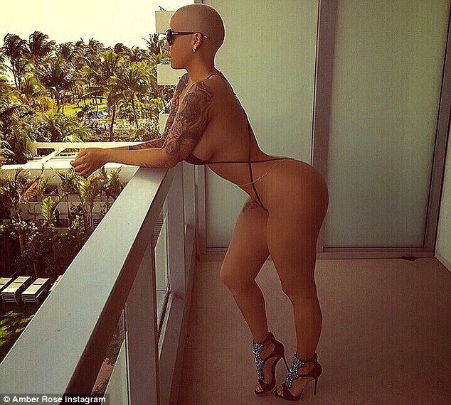 Nearly naked: Amber Rose shared Instagram photos on Saturday while clad in a barely-there black monokini picture