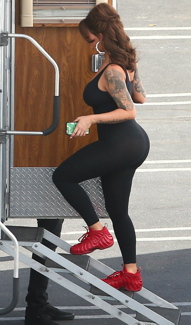 Amber Rose climbing into a trailer picture