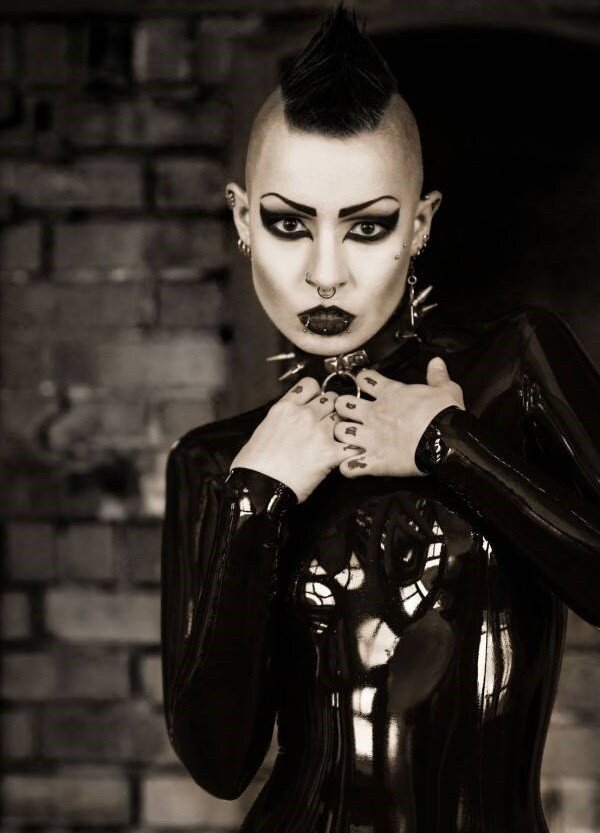 Toxic Devil is a sinister yung goth model in black latex with her weird hair emo mo hawk - fota lett gothh ppale collar picture