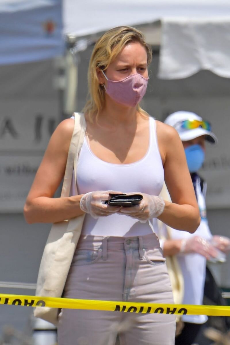 Brie Larson boobs in a white tank top and even with a bra showing her hard nipple pokies seen by paparazzi at a farmers market. picture