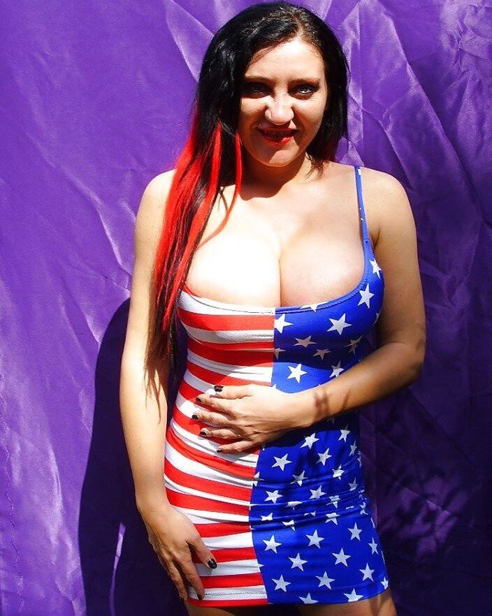Ethelida Nematode is a milf porn star w/ big huge tits blaring out of her USA dress for America w/ cleavage - SGB USAmerica picture