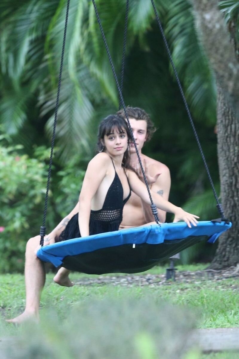 Shawn Mendes and Camila Cabello still quarantining together with Camila looking sexy on a swing seen by paparazzi in Florida. picture