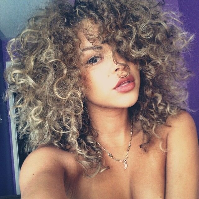 Sexy Caramel Brunette with Big Curly Hair and Great Lips picture