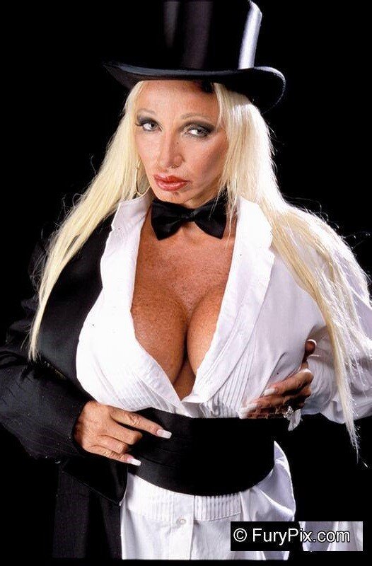 Roberta Black is a sexy older porn star with huge milf tits under her white button up shirt as a magician w/ milf cleavage - SGB milff zxzx picture