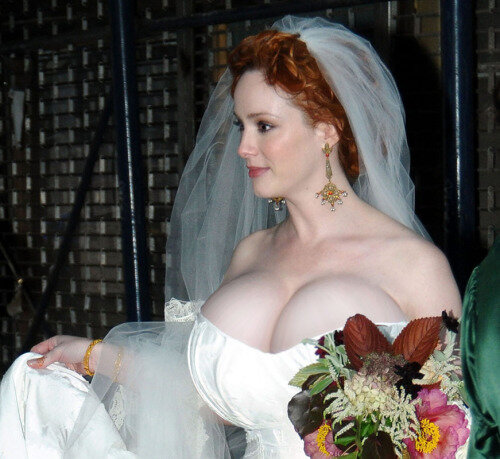 Christina Hendricks approaching the altar wearing her revealing wedding dress. A warning may have been issued by the astonished priest, who clearly mentioned that, unless the lady covered her sinful jumbo mammaries, he would have to suspend the... picture