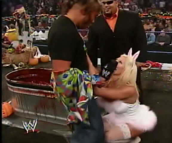 WWE Diva Torrie Wilson on her knees caps in hot bunny outfit Vs Dawn Marie! picture
