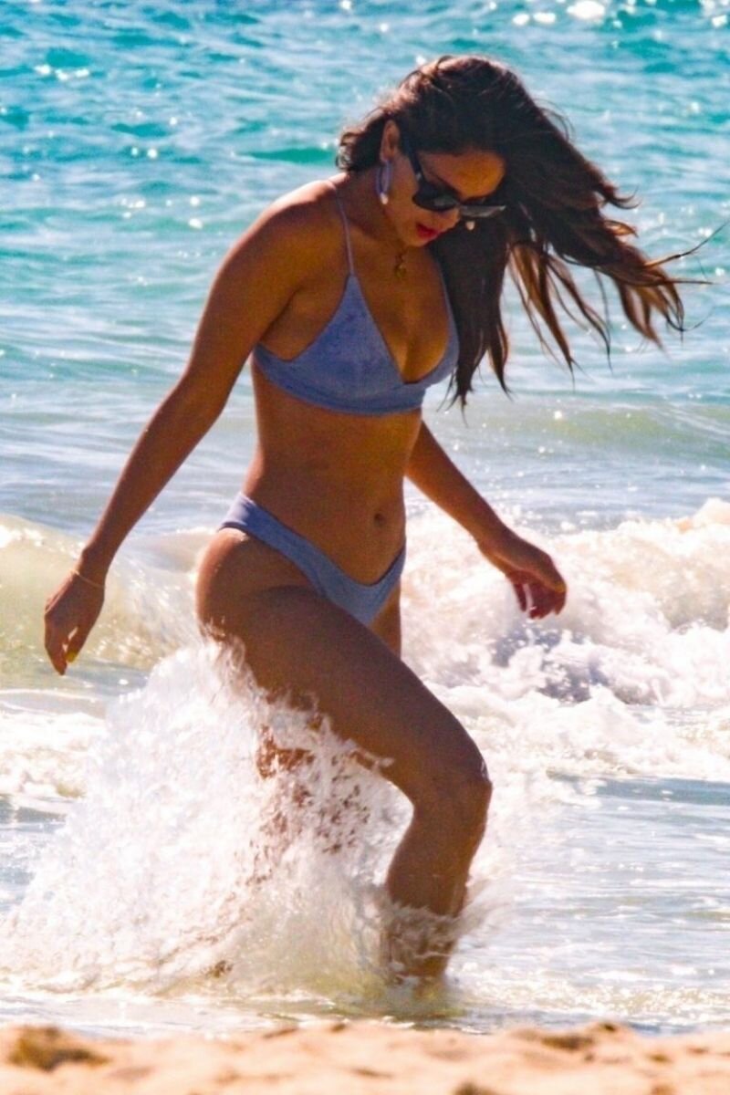 Eiza Gonzalez in a sexy blue bikini in the water and on the beach making out with her boyfriend seen by paparazzi showing nice cleavage with picture
