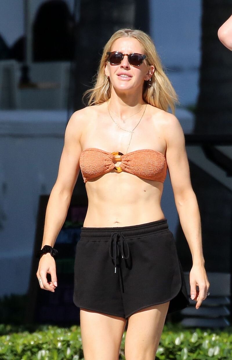 Ellie Goulding in a sexy little bikini top seen by paparazzi walking with her husband in Miami. picture