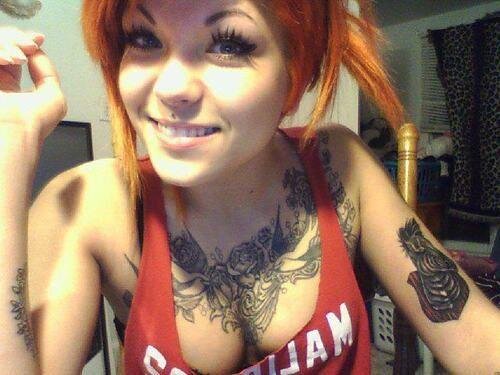 Nice tits on this tattooed redhead picture