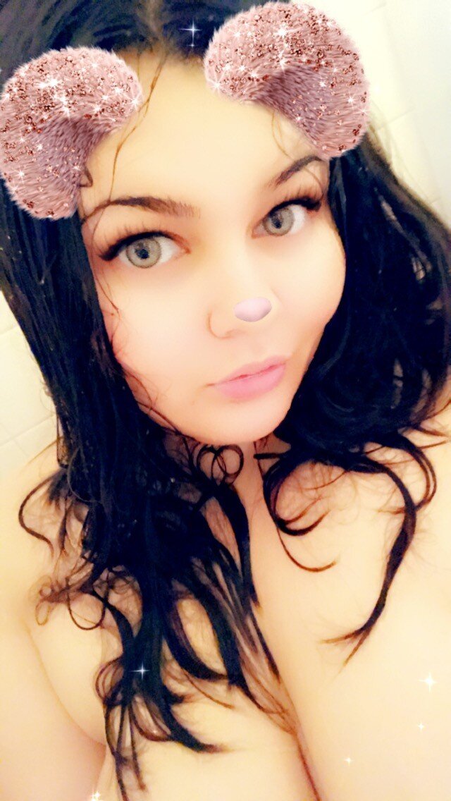 Green eyed babe taking shower picture