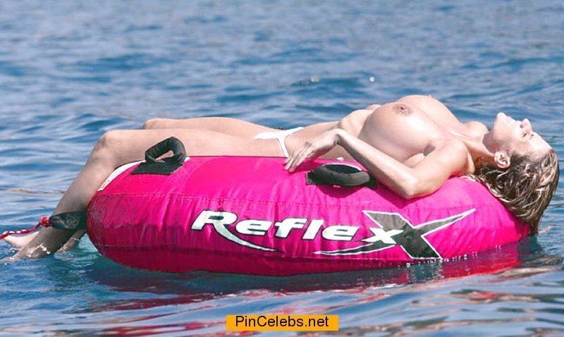Busty Katie Price sunbathing topless on a tube picture