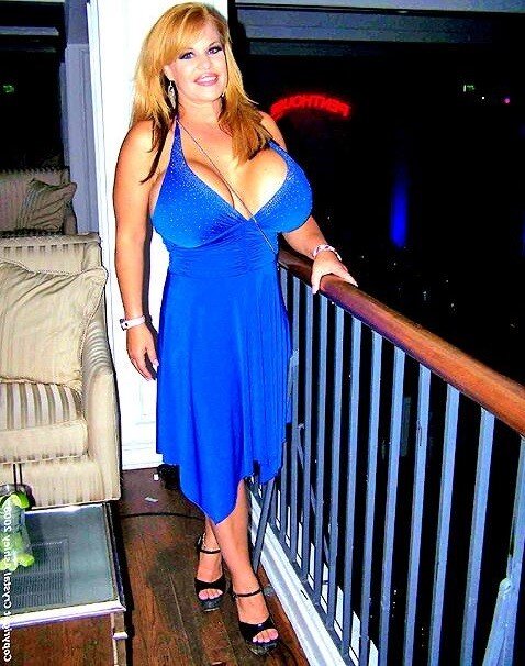 Consolata J Boyle is in electric blue dress with huge milf titties - SGB picture