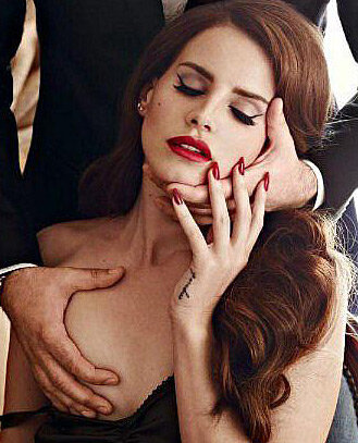 Lana Del Rey gets her right boob touched picture