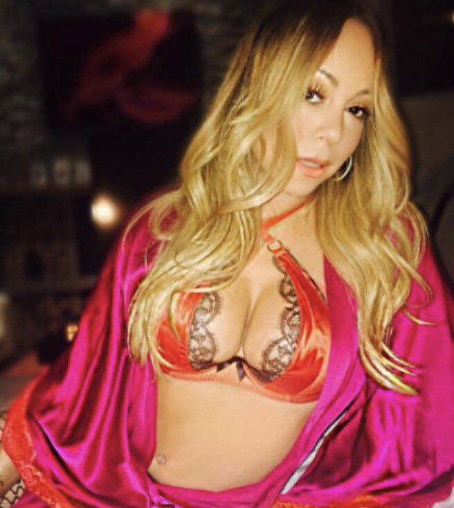 Mariah Carey with the perfect rack to give a titjob picture