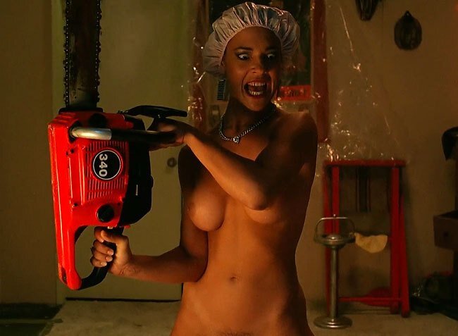 Scream queen Michelle Bauer naked chainsaw wielding for Halloween picture