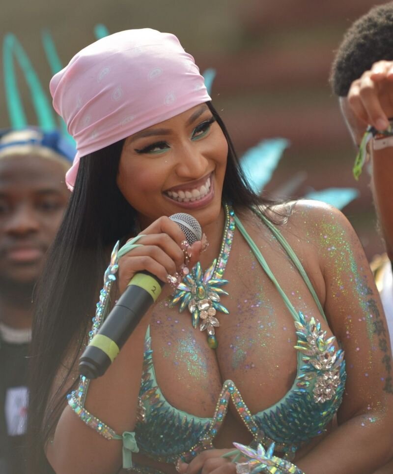 Nicki Minaj has a bit of nip slip areola peek wardrobe malfunction seen by paparazzi while showing off her big tits during Carnival. picture