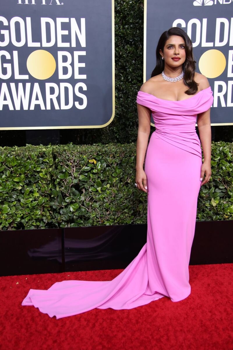 Priyanka Chopra showing nice cleavage with her big tits in a sexy pink dress arriving to the Golden Globe Awards. picture