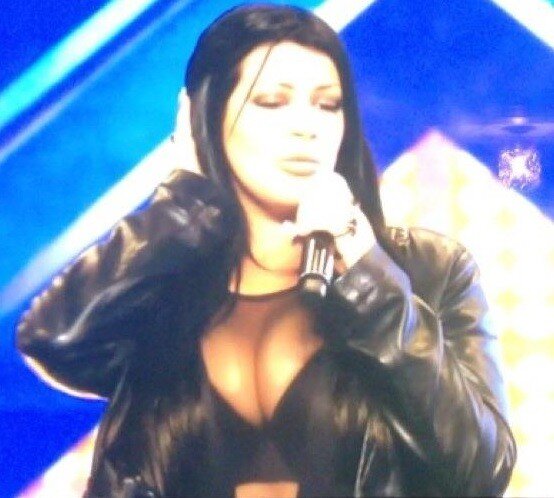 Micky Syndrome is star singer who sings her song in a skimpy see though top that shows her cleavage - fota 911 picture