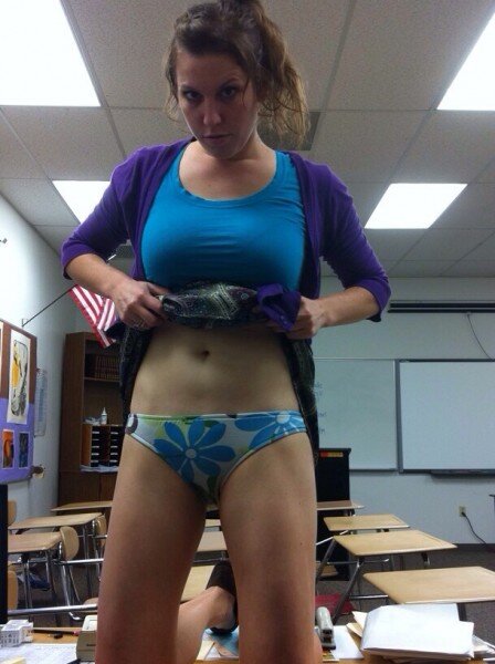 Hot teacher flashing her panties in the classroom! picture