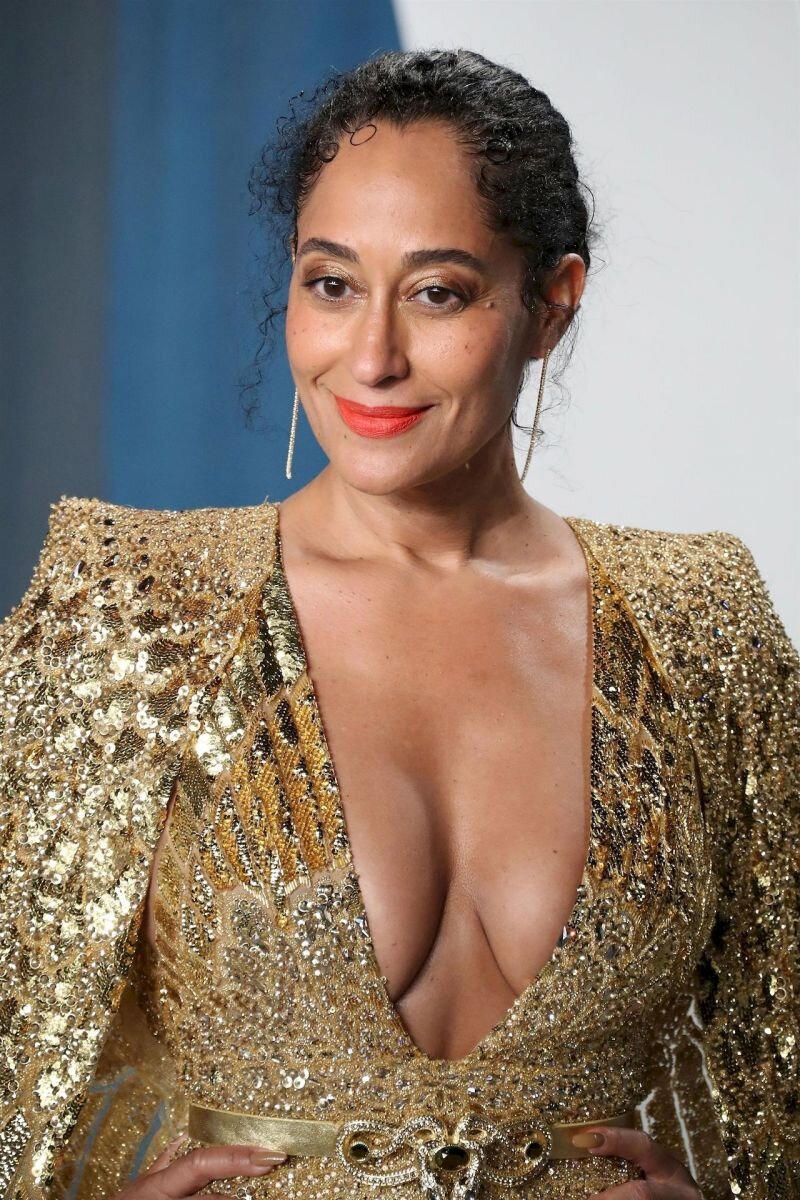 Tracee Ellis Ross braless boobs showing nice cleavage with her big tits in a low cut sexy gold dress at the Vanity Fair Oscar Party. picture