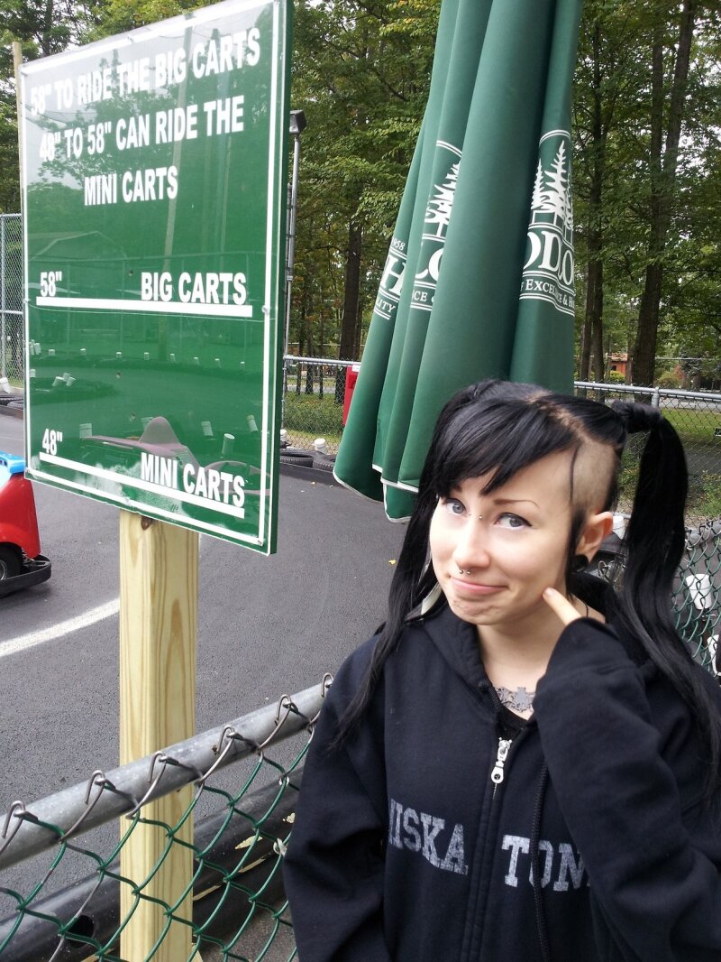 Paraquat Suicide makes a sexy goth facial expression while right outside by the go carts with awesome gothic black hair- SGB cooll gothh hff picture